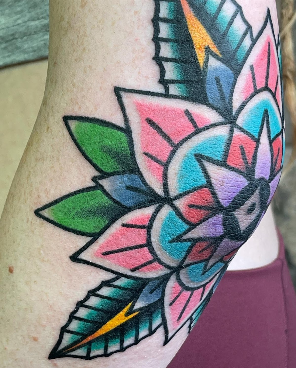 Inner Harbour Tattoo — geometric floral mandala in pink, blue and purple